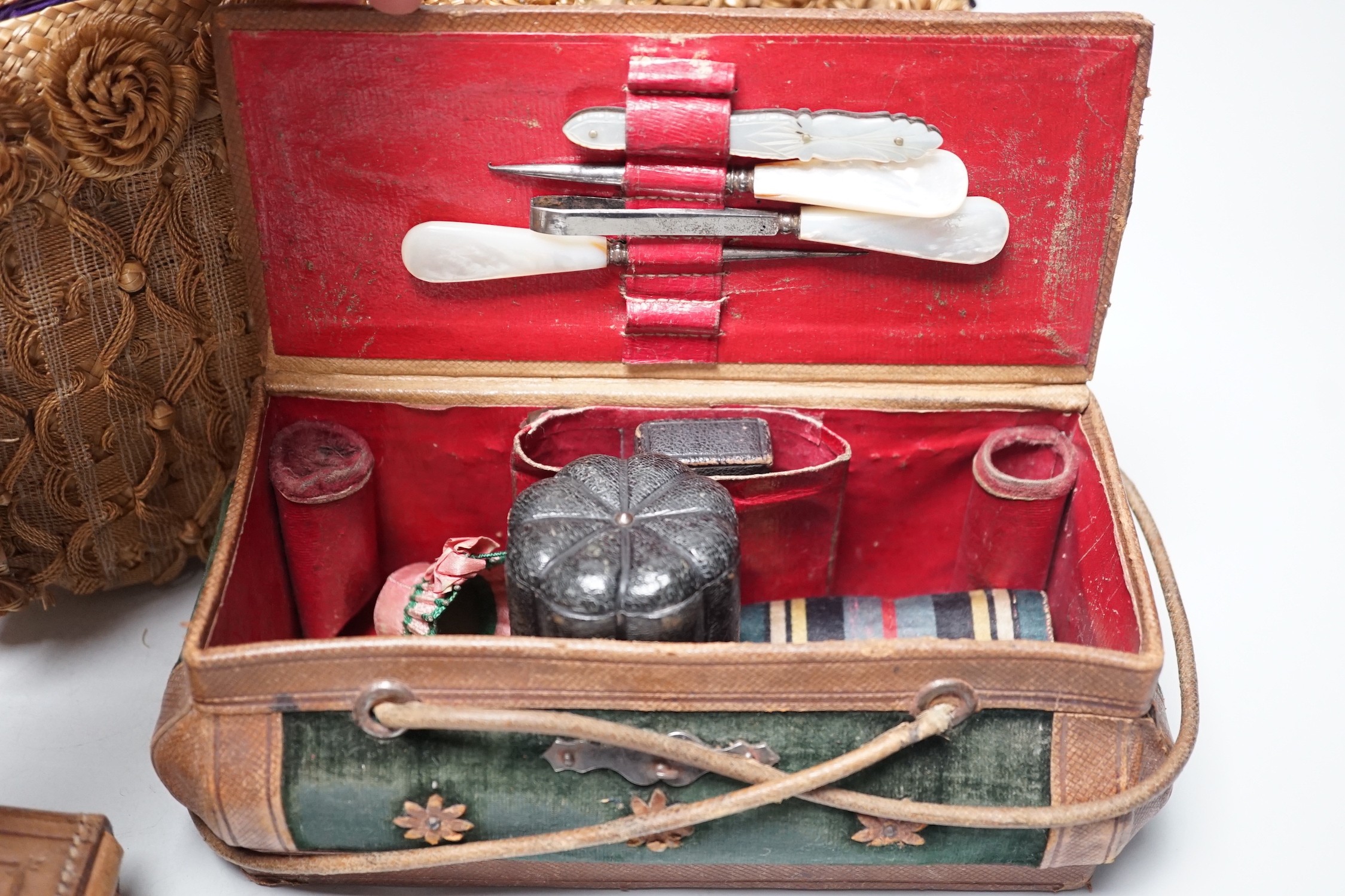 An unusual Edwardian straw and braided basket/bag, a French late 19th century basket with makers mark on metal mounts Berthelon, Macon, a small leather and velvet vanity case and contents and leather stationary case